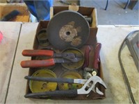 Hole saws, pliers, grinder stone