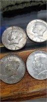 4 silver Kennedy half dollars