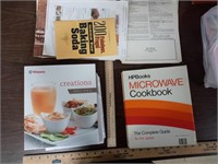 2 cookbooks a Vitamix cookbook an HP book