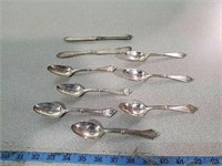Teaspoon and butter knives marked Sterling. 293