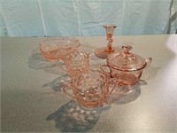 Several pieces pink depression glass. Please