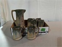 Signed ceramic pitcher and 6 cups