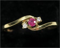 10K Yellow gold round brilliant cut ruby in bypass