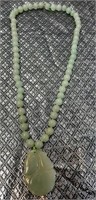 11 - CARVED GREEN JADE PENDANT & BEAD NECKLACE