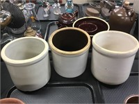 Three pottery crocks.
