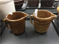 Two pottery pitchers.