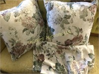 2 floral throw pillows with matching fabric