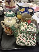 Teapots, pitchers, plates, biscotti jar.