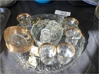 Hostess pieces, gold-trimmed glasses, saucers.