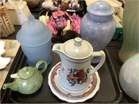 Pottery pieces, urn, teapot, plates.
