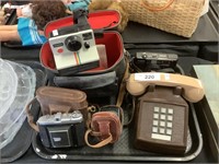 Rotary phone, vintage cameras, exposure meter.