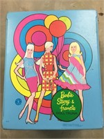 Vintage Barbie dolls and clothing in case.