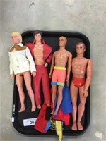 Four male dolls and clothes.