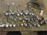 many small souvenir travel spoons crumb tray
