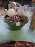 Green crock bowl with fabric balls