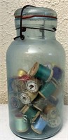 Atlas bail jar with spools of thread