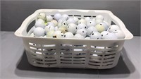 White plastic tub golfballs
