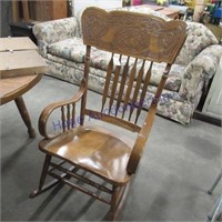 Rocking chair with carved wood design