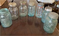 7 old glass jars