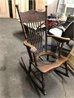 CARVED BACK ROCKING CHAIR W/ SPINDLES, BAD SEAT