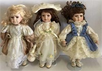 Three Porcelain Dolls with Glass Eyes