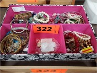 CONTAINER OF COSTUME JEWELRY- BRACELETS- MISC