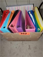 BOX OF COLORED 3 RING BINDERS