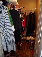 Master bedroom closet of clothes