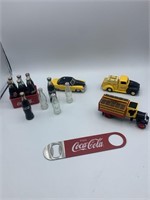 Flat with miniature coke bottles & case, 2 trucks