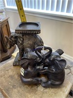 Two elephant figurines and elephant candle holder