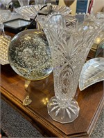 Crystal vase and crystal ball on brass stand