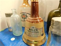 7 COLLECTABLE  BOTTLES  -  BELLS SCOTCH, PONDS,