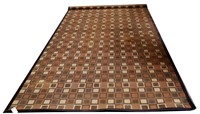 CONTEMPORARY LEATHER BOUND MACHINE WOVEN RUG