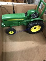 JD toy tractor with roll bar