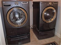 LG washer and dryer on stands