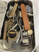 Box with watches, watch bands and tools
