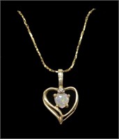 14K Yellow gold heart shaped opal pendant with