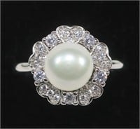 Sterling silver pearl ring with fancy cz halo,