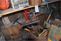 Tools on floor on left - pick, shovel, axe, hook,