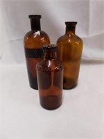 3 vintage brown glass medicine bottles. 7.5"