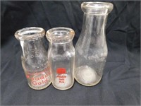 3 glass milk bottles. 2 embossed Meadow Gold  1/2