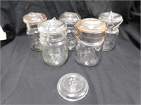 5 canning jars with an extra lid. One Security