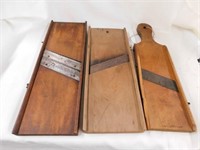 3 vintage wooden kraut cutting boards. One has a