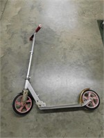 Razor scooter with 2 wheels. Silver, pink, and