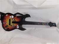 2 gaming guitars. One is Guitar hero and one is a