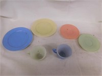 6 pieces pastel fired on glass childrens dishes.