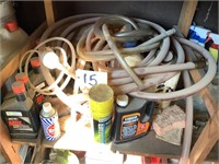 SHELF LOT OF OIL PRODUCTS & FUEL JIGGLERS