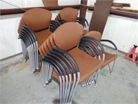 APPROX. 20 BROWN PADDED STACKING ARMCHAIRS