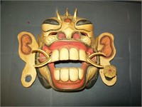 Wooden mask with movable mandible
