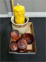 Flat of pottery and primitive candles